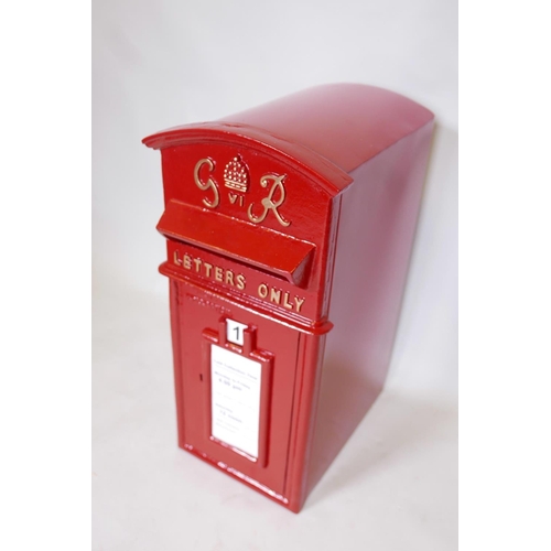 17 - A cast iron and metal postbox with key, 23