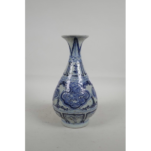 24 - A Chinese blue and white porcelain pear shaped vase with flared rim and stylised decoration, 10