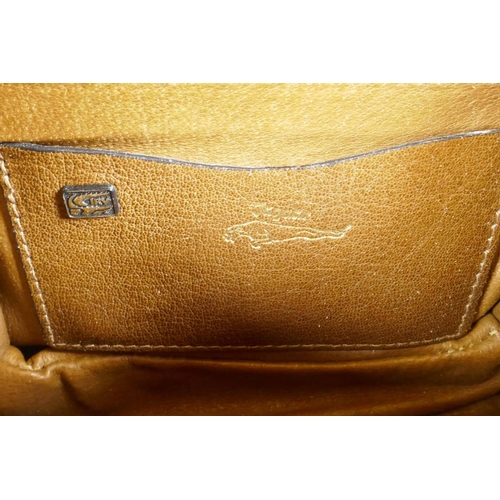 29 - A crocodile skin handbag by Jaguar, with shoulder strap, 9½