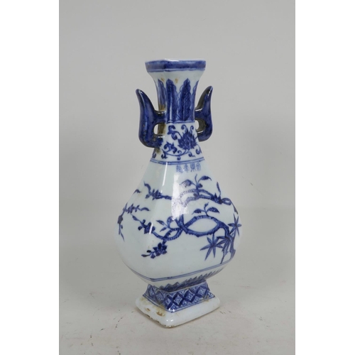 30 - A Chinese blue and white porcelain sectional vase with two lug handles and trailing branch decoratio... 