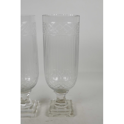 31 - A pair of cut glass hurricane vases , 13