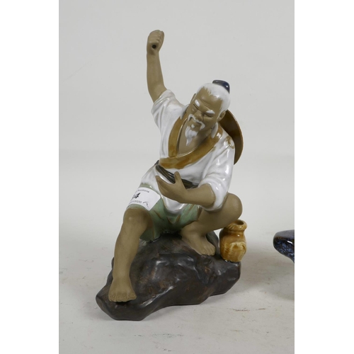 34 - Two oriental porcelain figurines of fishermen, largest 8