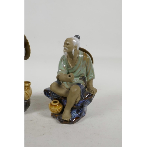 34 - Two oriental porcelain figurines of fishermen, largest 8