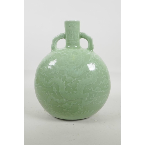 38 - A Chinese celadon glazed porcelain moon flask with two handles, with underglaze dragon decoration, s... 