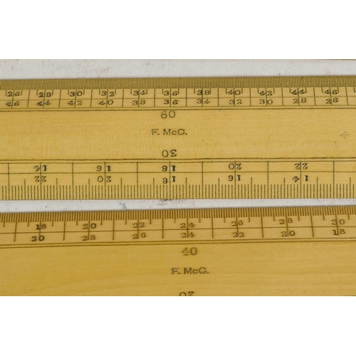 41 - A boxed set of engine divided boxwood surveyor's scale rules, together with a set of Eyre & Spottisw... 