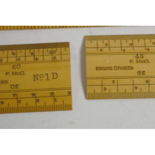 41 - A boxed set of engine divided boxwood surveyor's scale rules, together with a set of Eyre & Spottisw... 