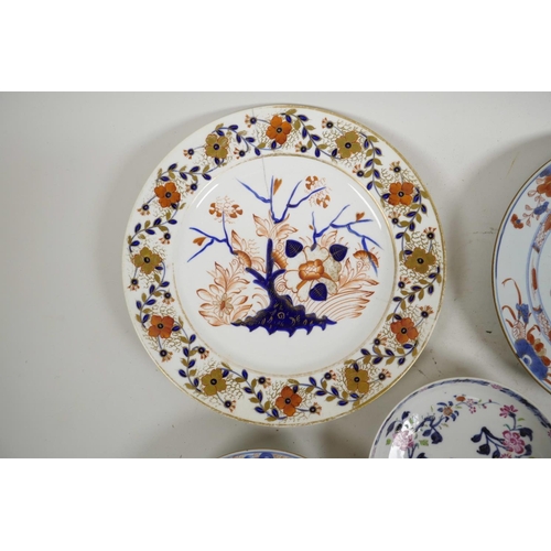 45 - Four C18th Chinese export porcelain plates in the Imari and famille rose style, and an early C19th D... 