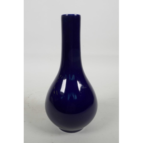 46 - A Chinese dark blue glazed bottle vase, the base marked with two concentric rings and six characters... 