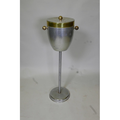 53 - A vintage metal ice bucket on stand with a plastic liner, 31