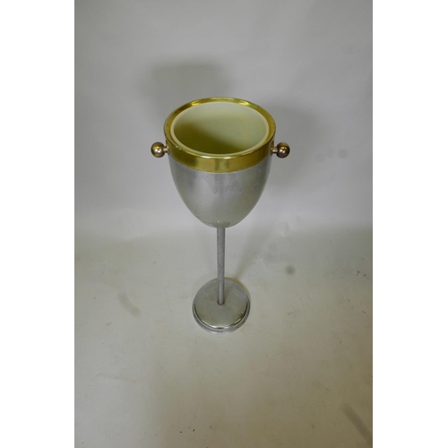 53 - A vintage metal ice bucket on stand with a plastic liner, 31