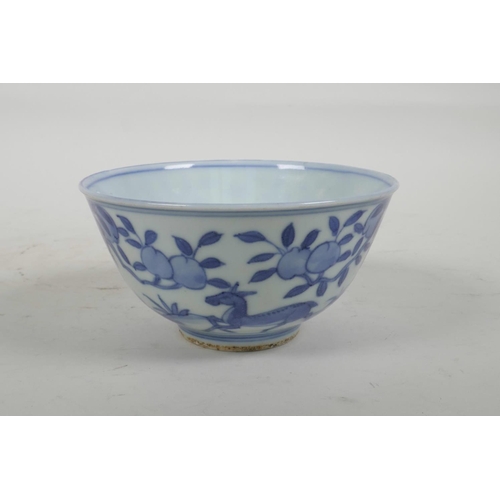 54 - A Chinese blue and white porcelain rice bowl decorated with deer amongst trees, six character mark t... 