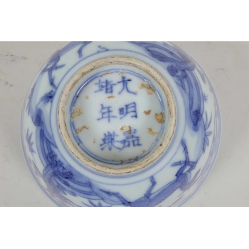 54 - A Chinese blue and white porcelain rice bowl decorated with deer amongst trees, six character mark t... 