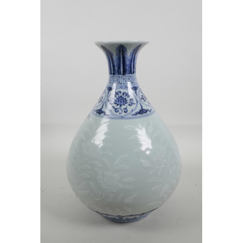 55 - A Chinese blue and white porcelain pear shaped vase with a flared rim, decorated with birds amongst ... 