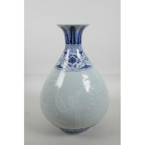 55 - A Chinese blue and white porcelain pear shaped vase with a flared rim, decorated with birds amongst ... 