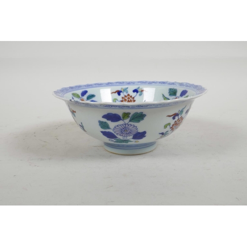 56 - A Chinese Doucai porcelain bowl with lobed rim painted with flowers, six character mark to base, 6