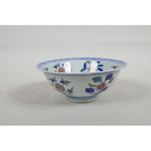 56 - A Chinese Doucai porcelain bowl with lobed rim painted with flowers, six character mark to base, 6