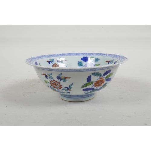 56 - A Chinese Doucai porcelain bowl with lobed rim painted with flowers, six character mark to base, 6