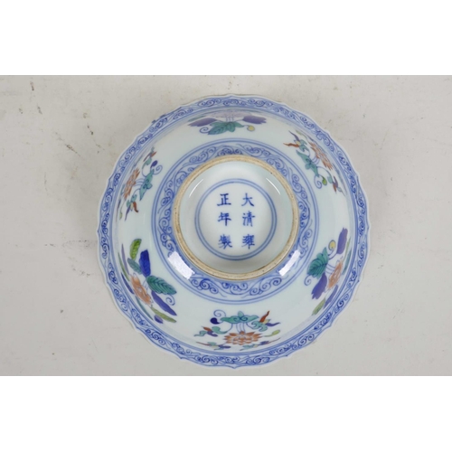 56 - A Chinese Doucai porcelain bowl with lobed rim painted with flowers, six character mark to base, 6