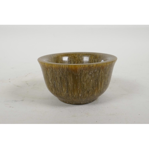 58 - A Chinese faux horn tea bowl, 3½