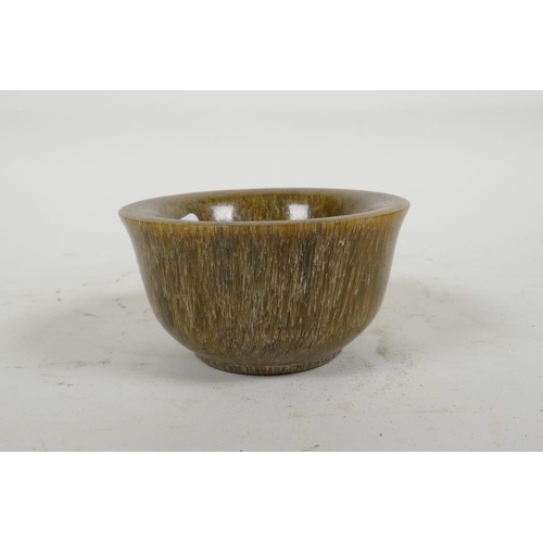 58 - A Chinese faux horn tea bowl, 3½