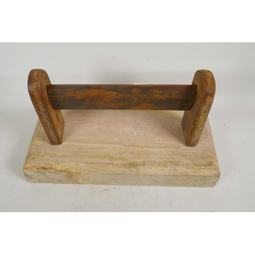 9 - A cast iron boot scraper set on a sandstone base, 15