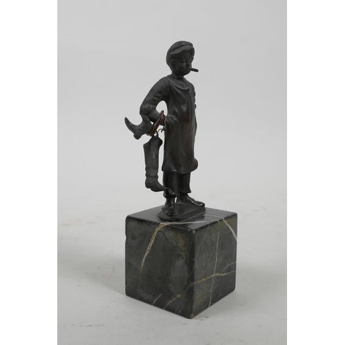 13 - A bronze figure of a young boot maker, 5