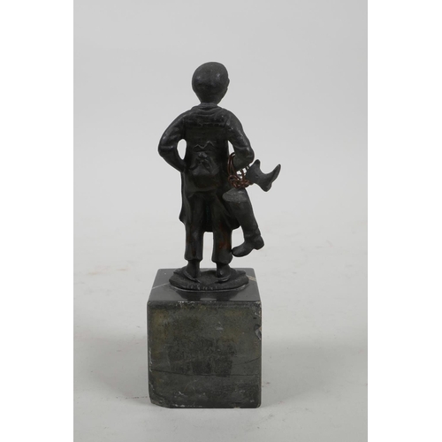 13 - A bronze figure of a young boot maker, 5