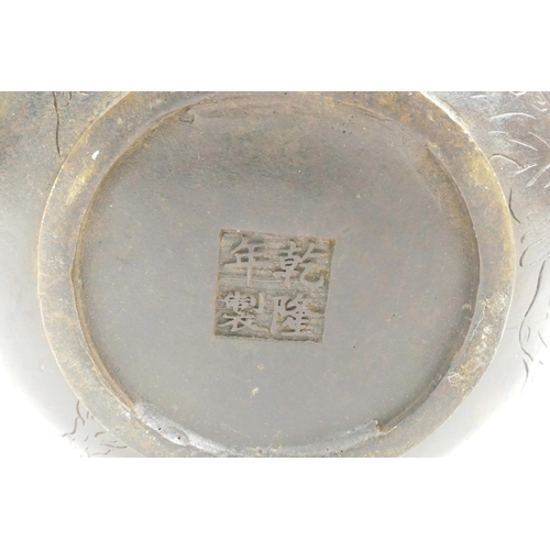 18 - A Chinese bronze teapot with raised decoration of cranes in flight, four character mark to base, 5½