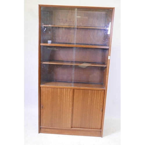 1820 - A Danish 1970s Herbert Elsibb Teak bookcase with glass doors, 36