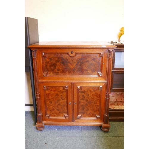 1821 - A C19th continental secretaire abattant with burr walnut panels, the fall front fitted with an eboni... 