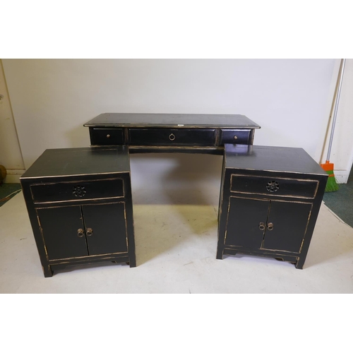 1827 - A Chinese style black lacquer bedroom suite comprising two bedside cabinets and a two drawer side ta... 