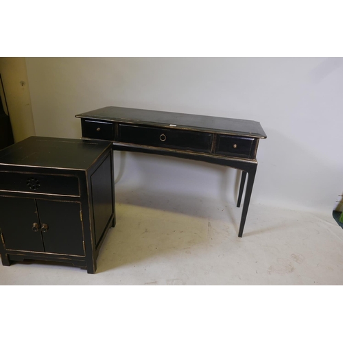 1827 - A Chinese style black lacquer bedroom suite comprising two bedside cabinets and a two drawer side ta... 