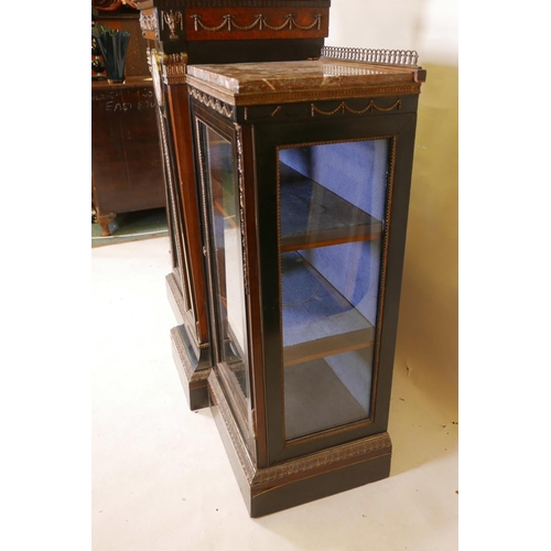 1830 - A C19th French breakfront pier cabinet, with brass inlaid ebonised doors and gilt brass classical mo... 