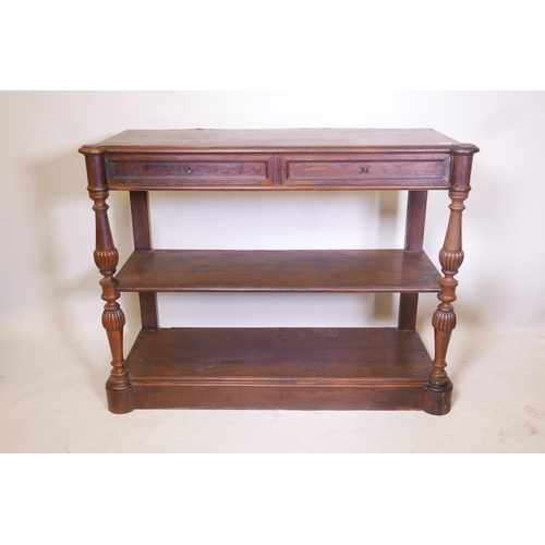 1832 - A C19th French rosewood three tier buffet, with two frieze drawers, raised on turned and carved supp... 