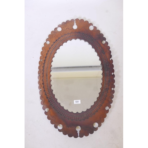 1841 - A wall mirror with tooled leather frame, 29