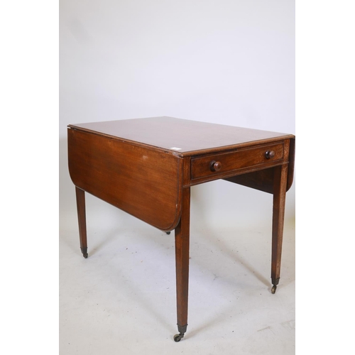 1857 - A George III mahogany pembroke table with single end drawer, raised on tapering supports, 36