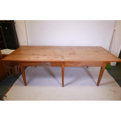 1861 - A French style fruitwood farmhouse table, raised on six square tapering supports, 43