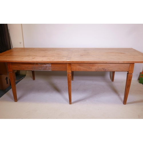 1861 - A French style fruitwood farmhouse table, raised on six square tapering supports, 43