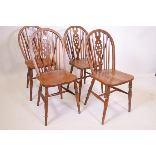 1865 - A set of four wheel back chairs with elm seats