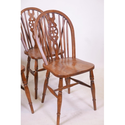 1865 - A set of four wheel back chairs with elm seats