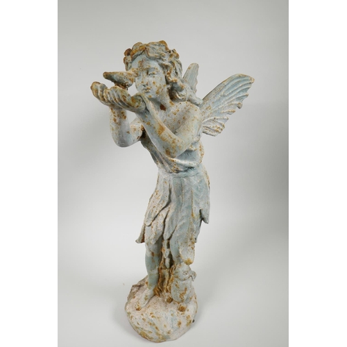 29 - A cast metal garden figure of a fairy holding a bird, 20