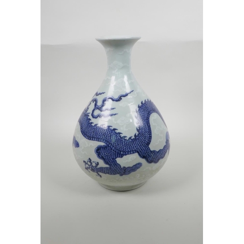 33 - A Chinese blue and white porcelain pear shaped vase decorated with a dragon in flight, six character... 