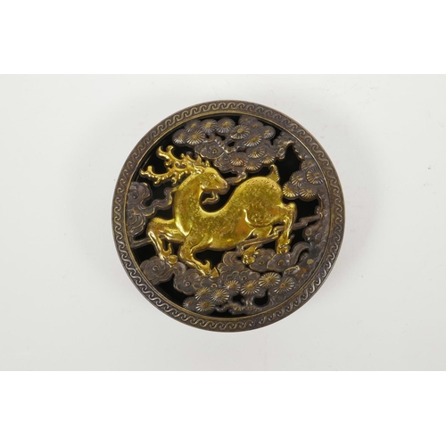 45 - A Chinese bronze cylinder incense box with a pierced cover decorated with a gilt deer, 4½