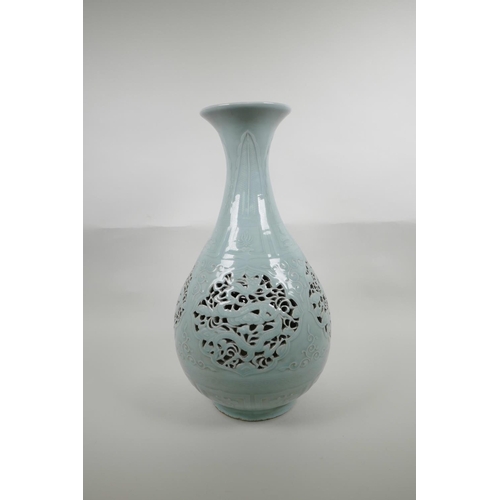 48 - A Chinese Ming style celadon glazed porcelain pear shaped vase with pierced and reticulated panels d... 