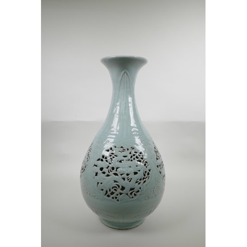 48 - A Chinese Ming style celadon glazed porcelain pear shaped vase with pierced and reticulated panels d... 