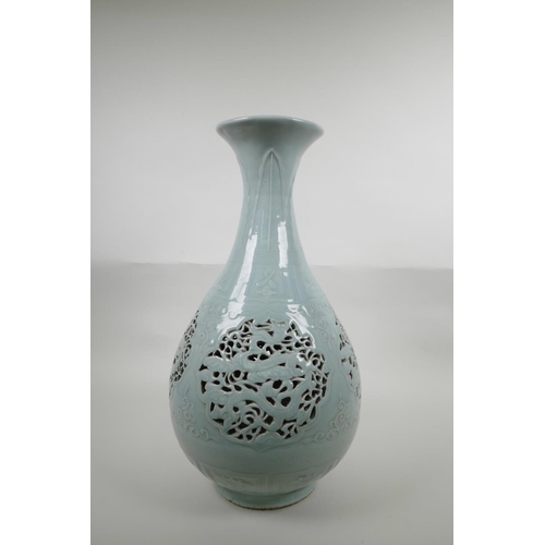 48 - A Chinese Ming style celadon glazed porcelain pear shaped vase with pierced and reticulated panels d... 