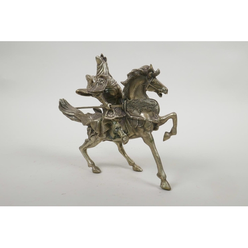 55 - A Chinese silvered metal figure of Guan Gong riding a horse, 7½