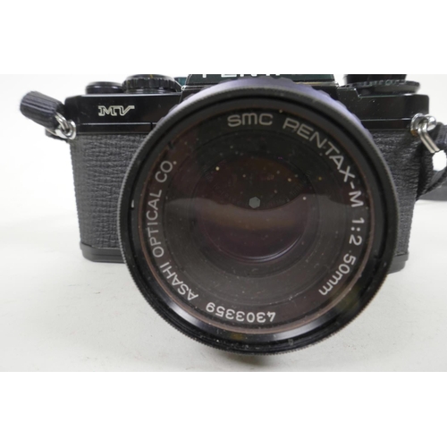 56 - A Pentax MV single lens reflex 35mm camera, together with a Pentax M 1:250 mm lens