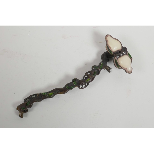 61 - A Chinese bronze ruyi in the form of a branch, set with green and white stones, 10½