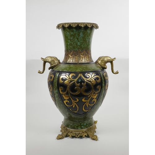 63 - A Chinese mottled green ground pottery vase with ormolu style mounts and elephant mask handles, the ... 